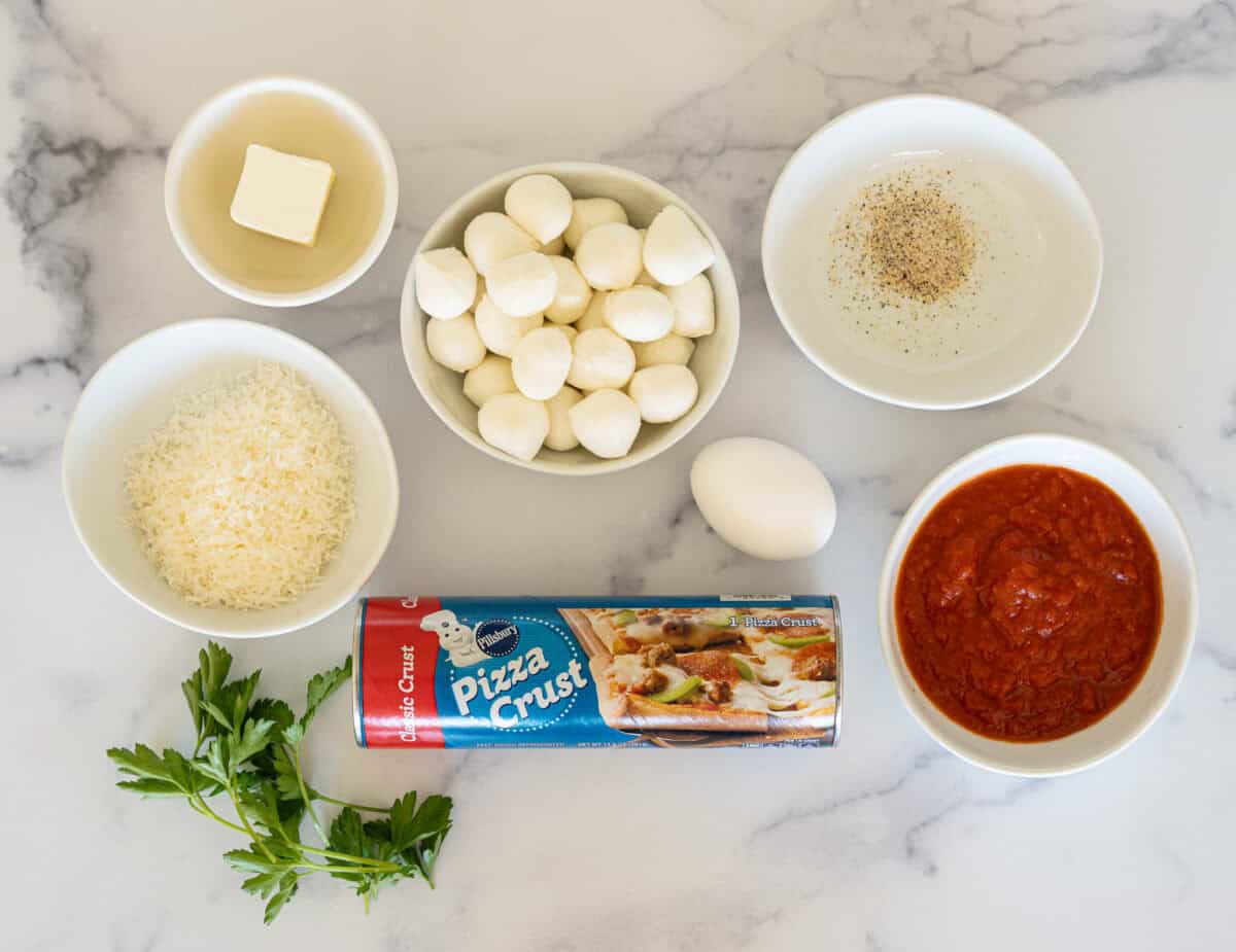 Ingredients: Cheese, butter, pizza crust, parsley, garlic salt, marinara sauce
