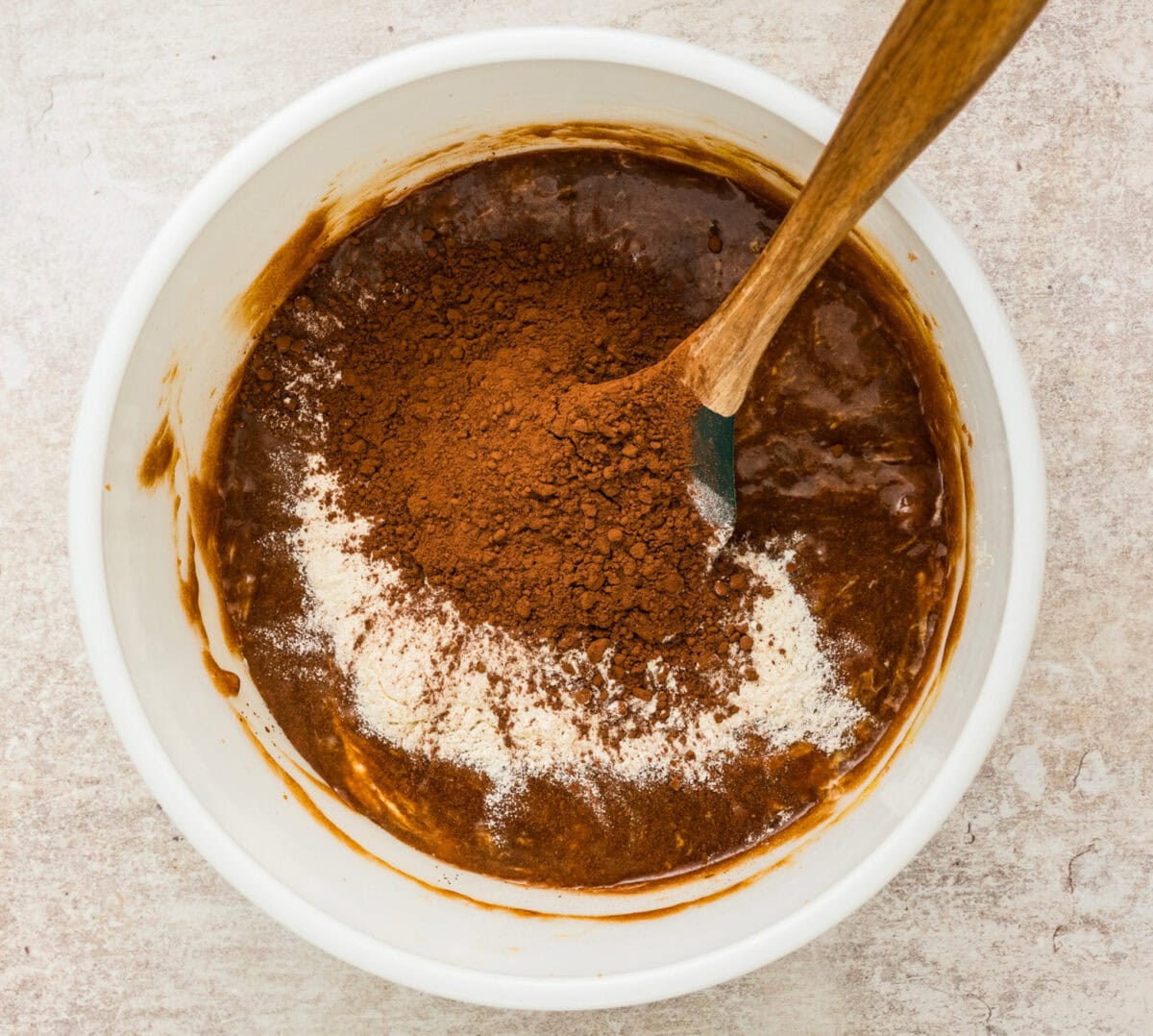 mixing cocoa powder into brownie mix